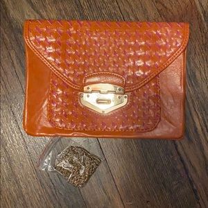 Convertible clutch. Orange & pink with gold chain